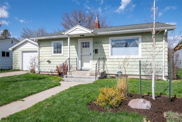 1634 W Central Ave, Missoula, MT 59801 - view of front of property with a chimney, a front lawn, a garage, and driveway