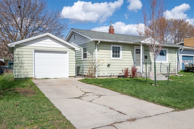 1634 W Central Ave, Missoula, MT 59801 - ranch-style home featuring a chimney, concrete driveway, a front yard, an outdoor structure, and a garage