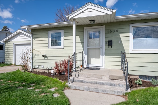 1634 W Central Ave, Missoula, MT 59801 - view of exterior entry with a garage