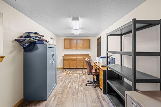538 Bighorn Dr, Thompson Falls, MT 59873 - office space with a textured ceiling, light wood finished floors, and baseboards