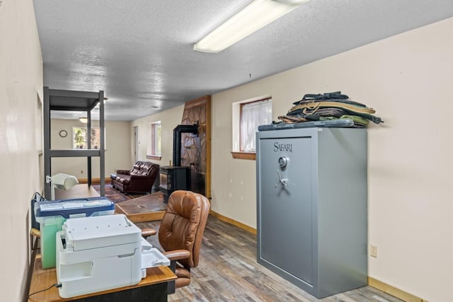 538 Bighorn Dr, Thompson Falls, MT 59873 - office space with baseboards, wood finished floors, and a textured ceiling