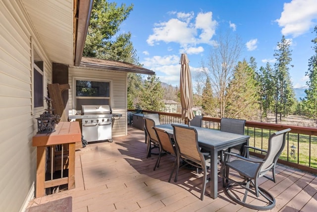 538 Bighorn Dr, Thompson Falls, MT 59873 - wooden terrace with outdoor dining space and area for grilling