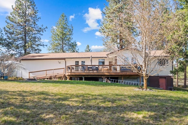 538 Bighorn Dr, Thompson Falls, MT 59873 - rear view of property featuring a deck and a lawn