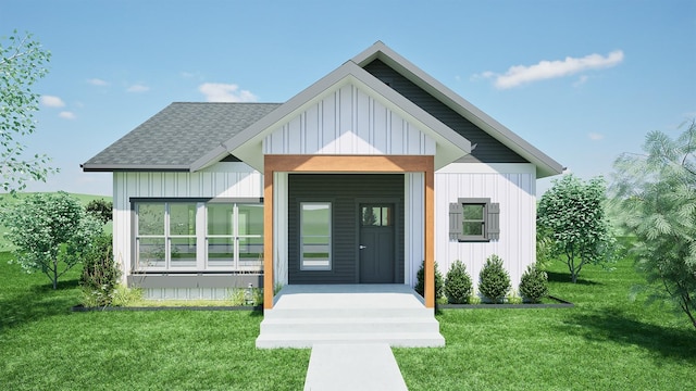 view of front of house with board and batten siding, a front yard, and a shingled roof