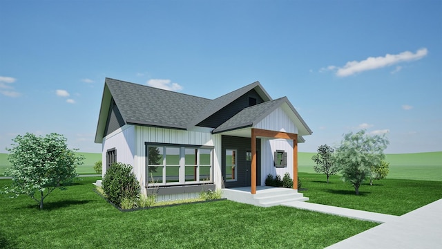view of front of house featuring a front yard, board and batten siding, and roof with shingles