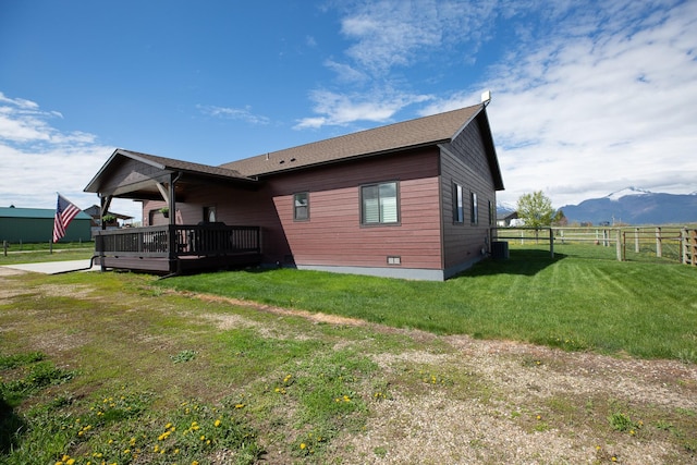 716 Shadow Dancer Way, Stevensville, MT 59870 - rear view of house with a deck with mountain view