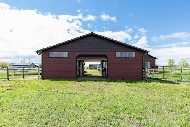 716 Shadow Dancer Way, Stevensville, MT 59870 - rear view of house featuring a garage, an outdoor structure, and an outbuilding