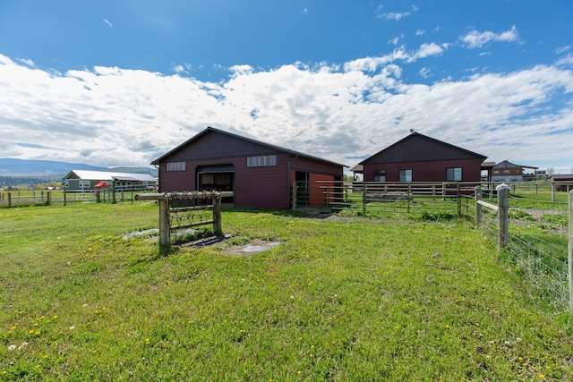 716 Shadow Dancer Way, Stevensville, MT 59870 - view of yard with an outdoor structure, a pole building, a view of countryside, and an exterior structure