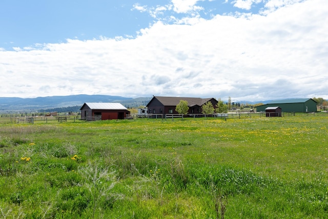 716 Shadow Dancer Way, Stevensville, MT 59870 - view of yard with a view of rural / pastoral area, an outbuilding, and a mountain view