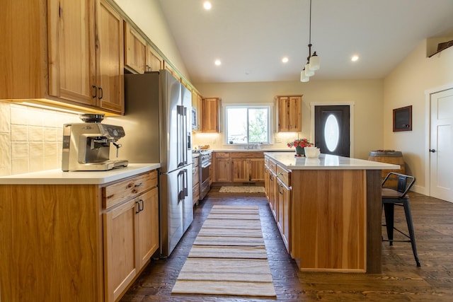 716 Shadow Dancer Way, Stevensville, MT 59870 - kitchen featuring a center island, recessed lighting, a breakfast bar, stainless steel appliances, and backsplash