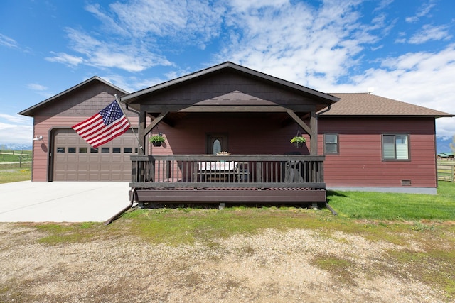716 Shadow Dancer Way, Stevensville, MT 59870 - view of front of property with a garage, concrete driveway, crawl space, and a wooden deck