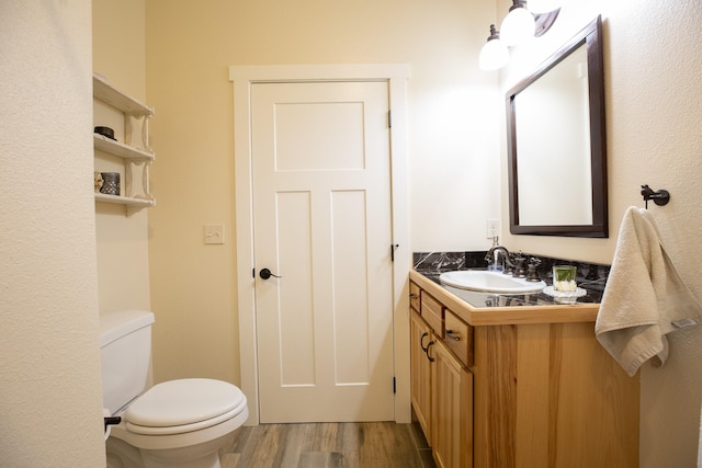 716 Shadow Dancer Way, Stevensville, MT 59870 - half bath with vanity and wood finished floors