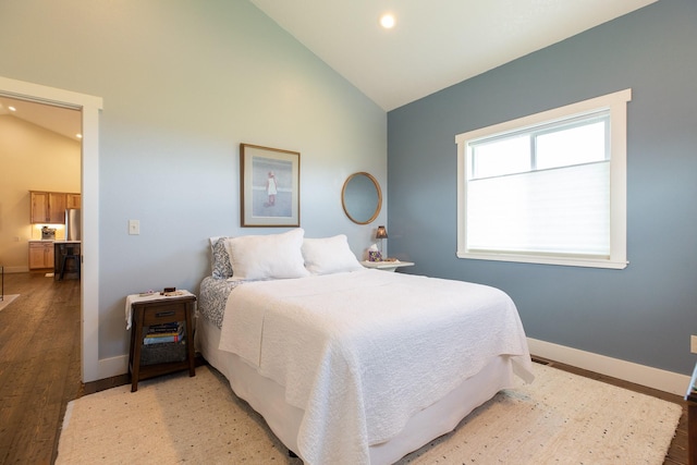 716 Shadow Dancer Way, Stevensville, MT 59870 - bedroom featuring freestanding refrigerator, light wood-type flooring, high vaulted ceiling, and recessed lighting