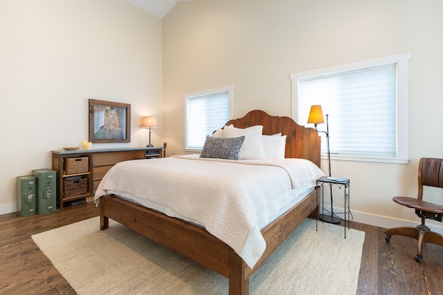 716 Shadow Dancer Way, Stevensville, MT 59870 - bedroom featuring wood finished floors and high vaulted ceiling