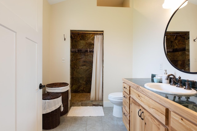 716 Shadow Dancer Way, Stevensville, MT 59870 - full bathroom with vanity, tiled shower, and tile patterned flooring
