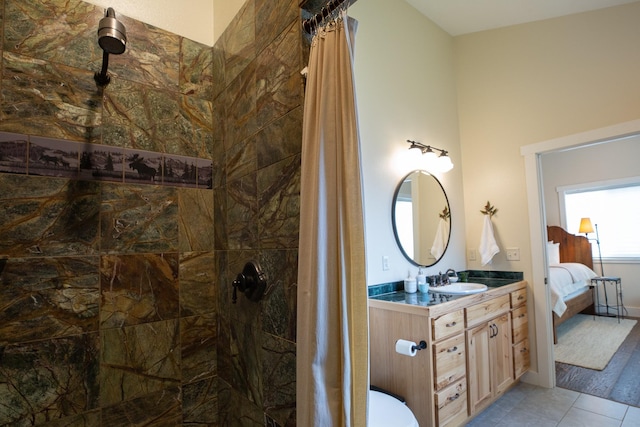 716 Shadow Dancer Way, Stevensville, MT 59870 - ensuite bathroom with tiled shower, vanity, and tile patterned floors