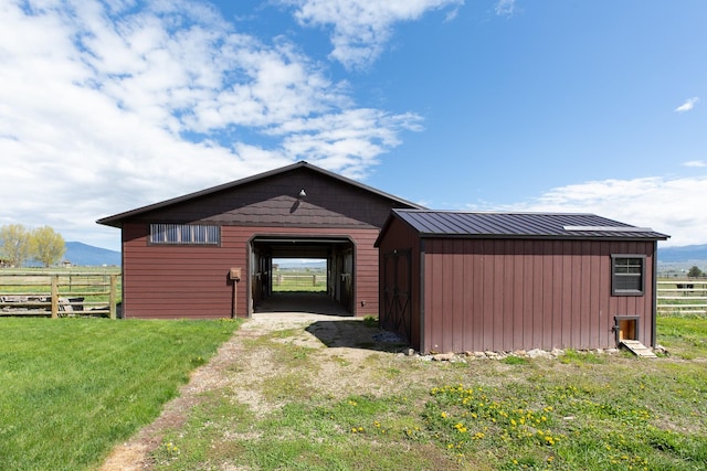 716 Shadow Dancer Way, Stevensville, MT 59870 - view of front of home with an outdoor structure, a metal roof, a standing seam roof, and an outbuilding