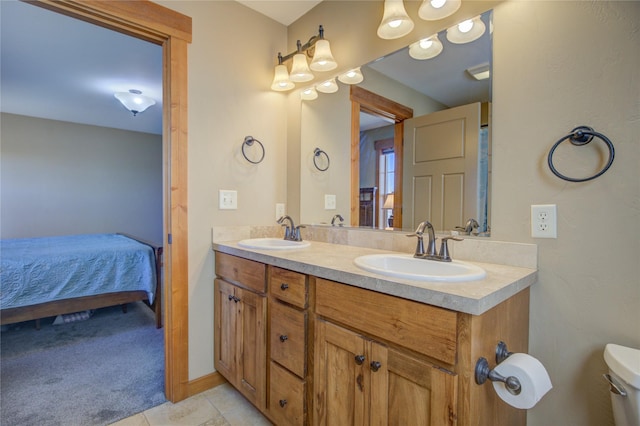 3774 Juliet Dr, Helena, MT 59602 - ensuite bathroom with toilet, connected bathroom, double vanity, and a sink