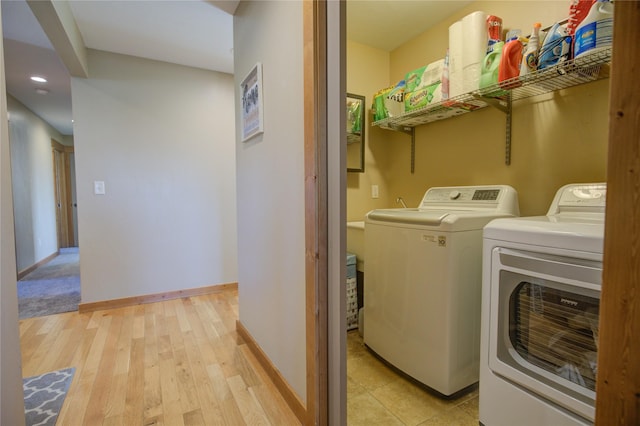 3774 Juliet Dr, Helena, MT 59602 - clothes washing area with baseboards, recessed lighting, separate washer and dryer, light wood finished floors, and laundry area