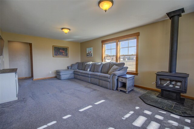 3774 Juliet Dr, Helena, MT 59602 - carpeted living area with a wood stove and baseboards