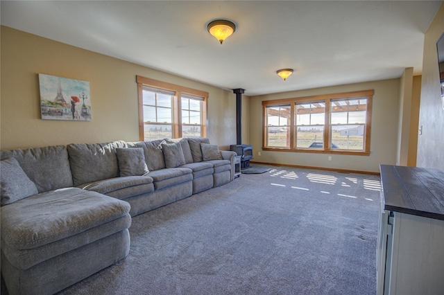 3774 Juliet Dr, Helena, MT 59602 - living area with baseboards, a wood stove, and carpet