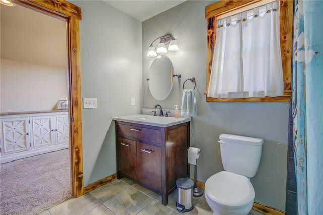 3774 Juliet Dr, Helena, MT 59602 - bathroom featuring toilet, vanity, and baseboards