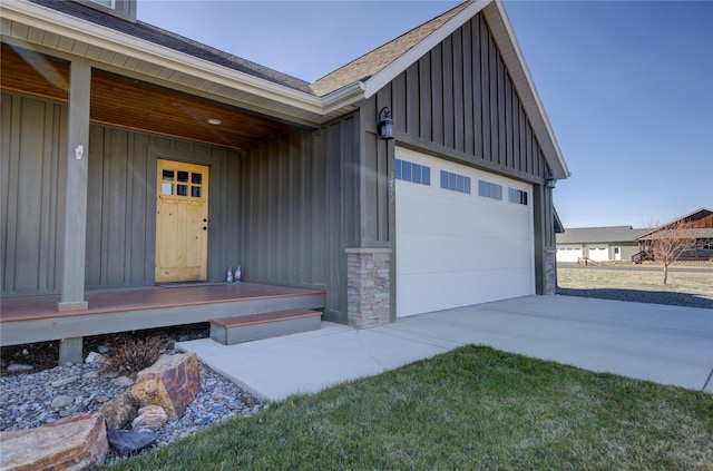 3774 Juliet Dr, Helena, MT 59602 - doorway to property with concrete driveway, board and batten siding, and an attached garage