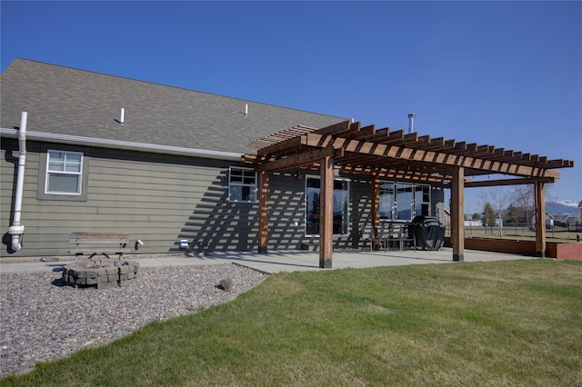 3774 Juliet Dr, Helena, MT 59602 - rear view of property featuring an outdoor fire pit, a shingled roof, a pergola, a patio area, and a lawn