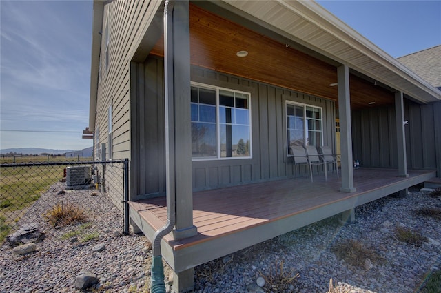 3774 Juliet Dr, Helena, MT 59602 - view of side of home with central AC unit, board and batten siding, and fence