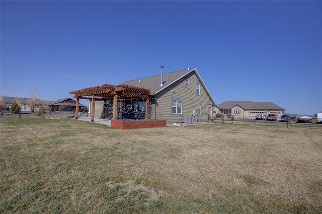 3774 Juliet Dr, Helena, MT 59602 - rear view of house with a fenced backyard, a yard, central air condition unit, a patio area, and a pergola