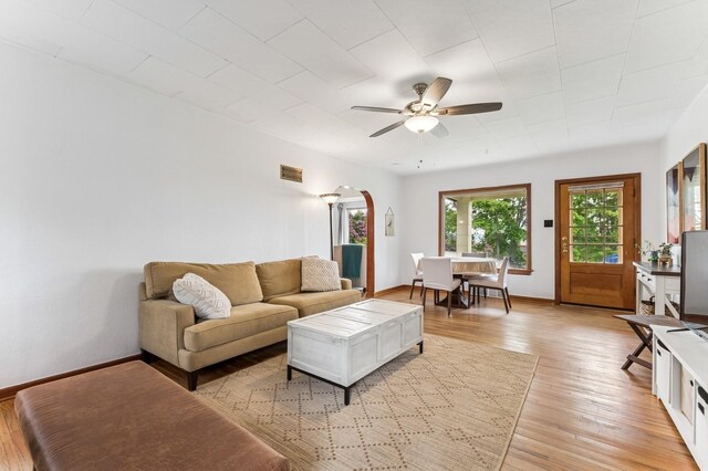 14668 Shore Acres Dr, Bigfork, MT 59911 - living room with ceiling fan, light wood-type flooring, and arched walkways