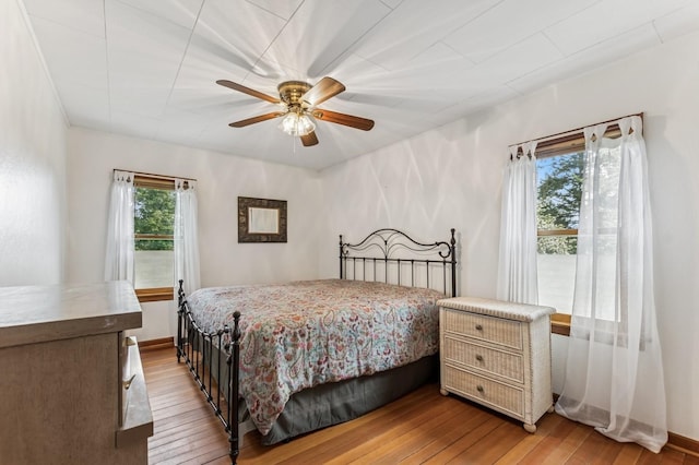 14668 Shore Acres Dr, Bigfork, MT 59911 - bedroom featuring light wood-style floors and a ceiling fan
