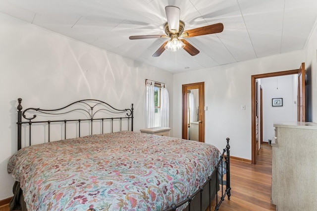 14668 Shore Acres Dr, Bigfork, MT 59911 - bedroom featuring wood finished floors and a ceiling fan