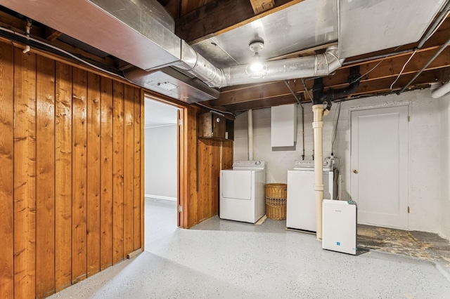 14668 Shore Acres Dr, Bigfork, MT 59911 - unfinished below grade area featuring washer and clothes dryer and wooden walls