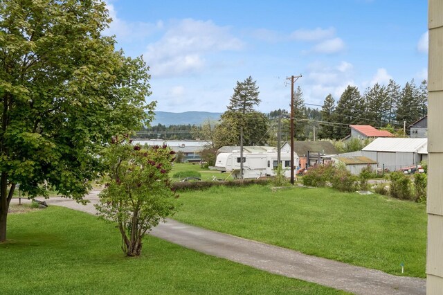 14668 Shore Acres Dr, Bigfork, MT 59911 - view of grassy yard with a mountain view
