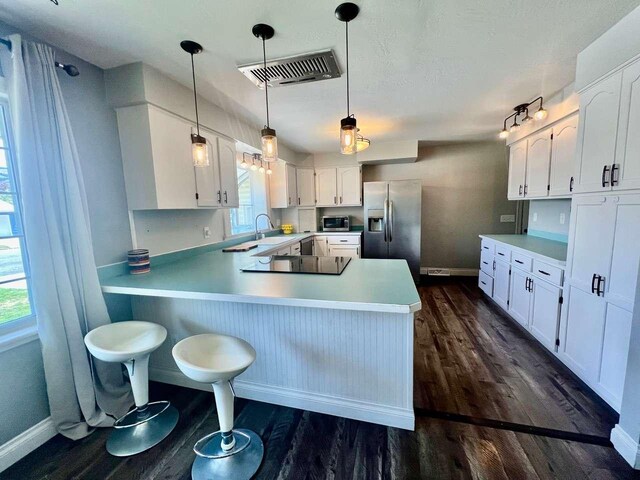 4217 Larkspur Dr, Missoula, MT 59803 - bedroom featuring baseboards, wood finished floors, and access to exterior