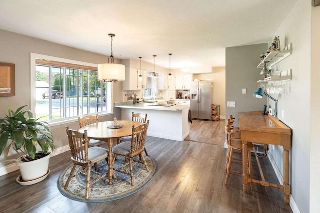 4217 Larkspur Dr, Missoula, MT 59803 - dining space with baseboards and dark wood-type flooring
