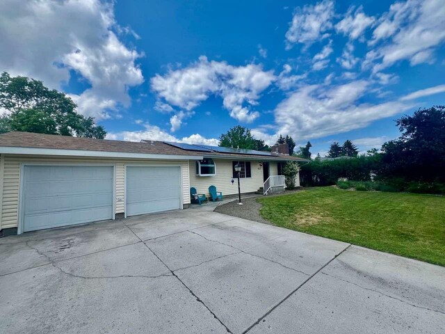 4217 Larkspur Dr, Missoula, MT 59803 - kitchen with light countertops, stainless steel appliances, white cabinetry, a peninsula, and wood finished floors