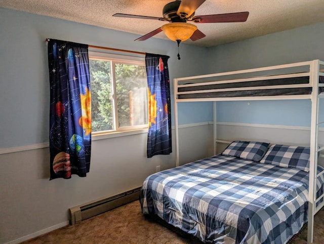 2599 Pike Dr, East Helena, MT 59635 - carpeted bedroom with baseboards, a baseboard radiator, a textured ceiling, and ceiling fan