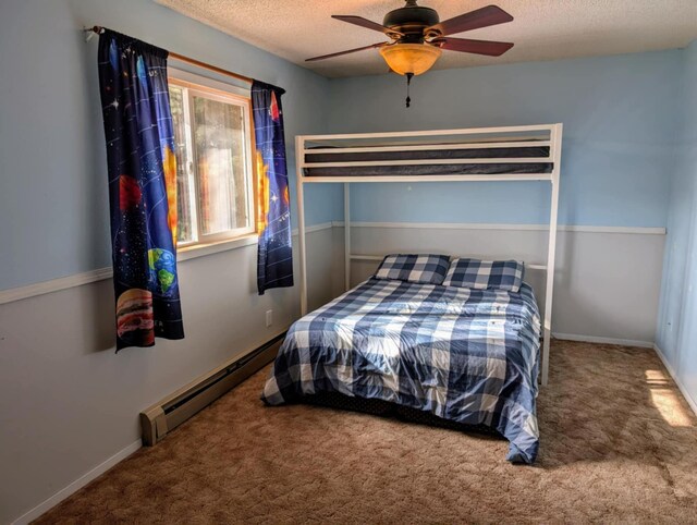 2599 Pike Dr, East Helena, MT 59635 - bedroom featuring a textured ceiling, carpet, and baseboard heating