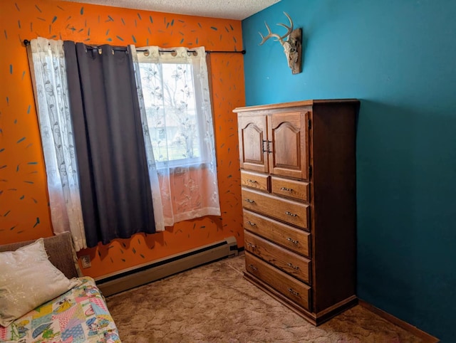 2599 Pike Dr, East Helena, MT 59635 - bedroom featuring light carpet, a baseboard radiator, and a textured ceiling