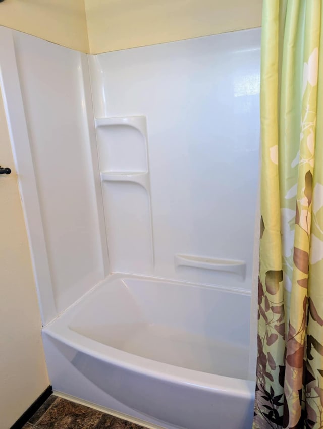 2599 Pike Dr, East Helena, MT 59635 - bathroom featuring shower / tub combo and baseboards