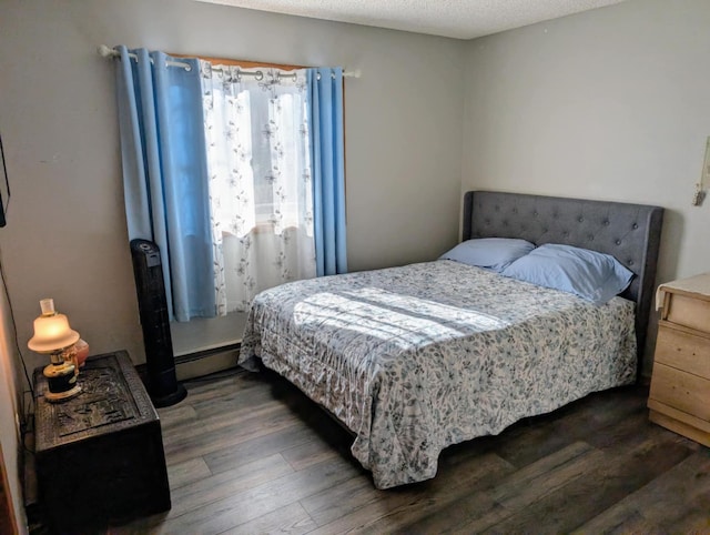 2599 Pike Dr, East Helena, MT 59635 - bedroom featuring a baseboard radiator and wood finished floors