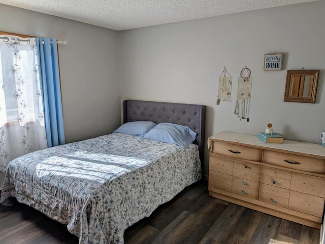 2599 Pike Dr, East Helena, MT 59635 - bedroom featuring a textured ceiling and dark wood-style floors