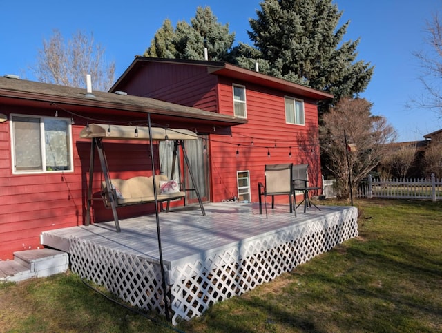 2599 Pike Dr, East Helena, MT 59635 - rear view of house featuring a yard, fence, and a deck