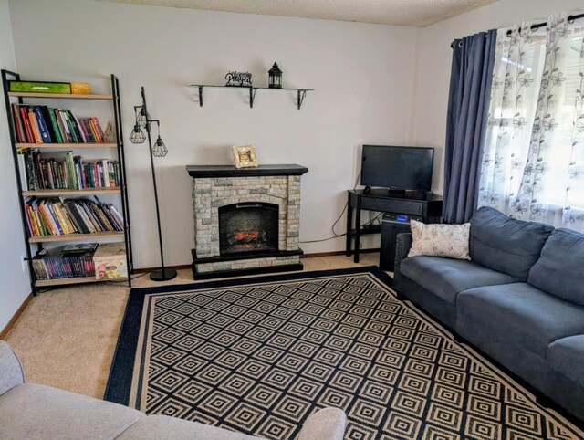 2599 Pike Dr, East Helena, MT 59635 - carpeted living area with baseboards and a stone fireplace