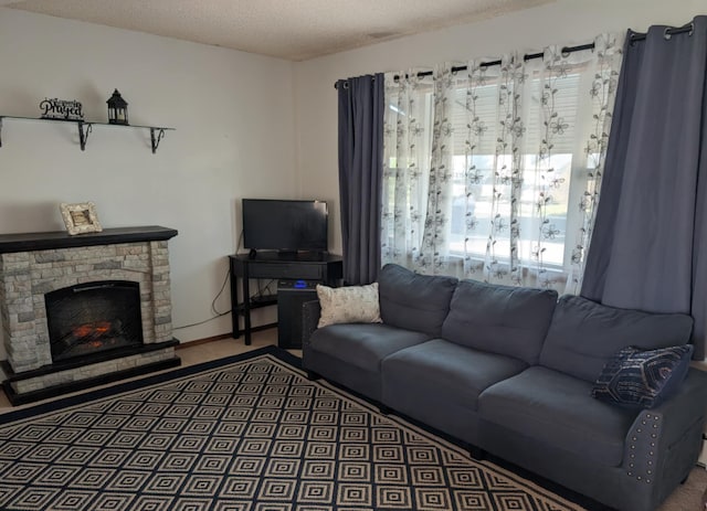 2599 Pike Dr, East Helena, MT 59635 - living room featuring a stone fireplace and a textured ceiling