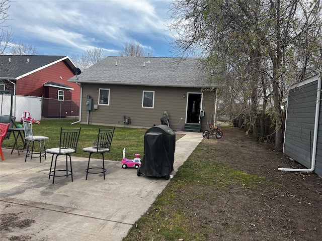 323 3rd Ave SW, Great Falls, MT 59404 - rear view of house featuring a patio area and roof with shingles
