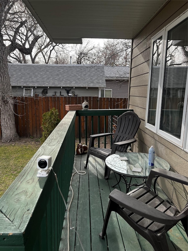 wooden deck with outdoor dining space and fence private yard