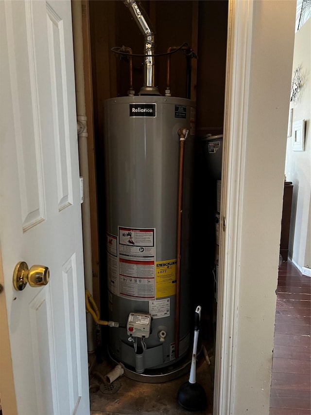 utility room featuring gas water heater